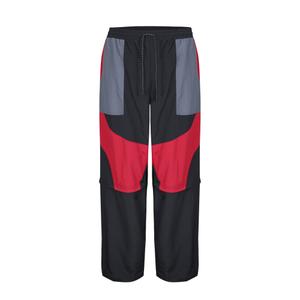 1222970-60-0-83-spodnie-umbro-zip-of-l-fit-black-red-dahila-iron